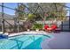 Peaceful poolside view with tropical plants at 8918 Kittanning Ave, Orlando, FL 32836