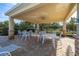 Covered patio area with table and chairs near the community pool at 8918 Kittanning Ave, Orlando, FL 32836