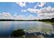 Tranquil lake view with lush greenery and lily pads at 952 Lake Destiny Rd # G, Altamonte Springs, FL 32714