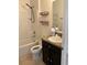 Bathroom with tub, sink and shelving at 146 Prairie Falcon Dr, Groveland, FL 34736
