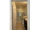 Bathroom with double vanity, shower, and grab bars at 146 Prairie Falcon Dr, Groveland, FL 34736