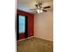 Bright bedroom with ceiling fan and neutral carpeting at 146 Prairie Falcon Dr, Groveland, FL 34736