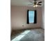 Bright bedroom with window and ceiling fan at 146 Prairie Falcon Dr, Groveland, FL 34736