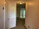 Interior view of an entryway with neutral-colored walls and carpet at 146 Prairie Falcon Dr, Groveland, FL 34736
