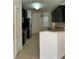 Kitchen features granite countertops and dark wood cabinets at 146 Prairie Falcon Dr, Groveland, FL 34736