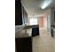 Kitchen with dark cabinets and granite counters at 146 Prairie Falcon Dr, Groveland, FL 34736