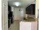 Kitchen features granite countertops and dark wood cabinets at 146 Prairie Falcon Dr, Groveland, FL 34736