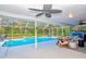 Spacious screened pool area with seating and a view of lush greenery at 116 Reflection Blvd, Auburndale, FL 33823