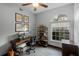 Bright home office with wood desk and built-in shelving at 1216 Brampton Pl, Lake Mary, FL 32746