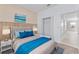 Bright bedroom with wood-like accent wall and plush bedding at 12233 Satire St, Orlando, FL 32832