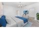 Primary bedroom with a plush bed and blue accents at 12233 Satire St, Orlando, FL 32832