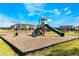 Community playground with swings, slides, and climbing structures at 1511 Isleta Loop, Kissimmee, FL 34741