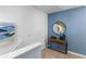 Upstairs hallway with a stylish console table and mirror at 1511 Isleta Loop, Kissimmee, FL 34741