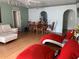 Bright dining area with hardwood floors and a wooden table at 209 Curtis Ave, Groveland, FL 34736