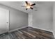 Spacious bedroom with hardwood floors and ceiling fan at 225 E Grant St, Orlando, FL 32806