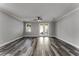 Bright living room with hardwood floors and sliding glass doors at 225 E Grant St, Orlando, FL 32806