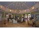 Grand clubhouse interior with high ceilings, chandelier, and comfortable seating at 2322 Caledonian St, Clermont, FL 34711