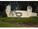 Elegant Summit Greens community entrance sign surrounded by manicured landscaping at 2322 Caledonian St, Clermont, FL 34711