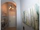 Bright entryway with decorative wall art and shelving at 2322 Caledonian St, Clermont, FL 34711