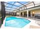 Private screened pool with patio furniture at 2613 Calistoga Ave, Kissimmee, FL 34741