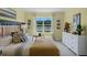 Spacious bedroom with a comfortable bed and neutral decor at 3800 Paragon Ln, Clermont, FL 34714