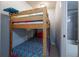 Small bedroom with a bunk bed and access to a bathroom at 4155 S Atlantic Ave # 210, New Smyrna Beach, FL 32169
