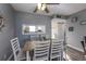 Bright dining area with table and chairs at 4155 S Atlantic Ave # 210, New Smyrna Beach, FL 32169