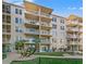 Three-story building with oceanfront location and lush landscaping at 4155 S Atlantic Ave # 210, New Smyrna Beach, FL 32169