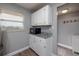 White cabinets, granite countertops, and microwave at 4155 S Atlantic Ave # 210, New Smyrna Beach, FL 32169