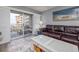 Living room with ocean view and sliding glass doors leading to balcony at 4155 S Atlantic Ave # 210, New Smyrna Beach, FL 32169