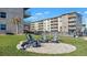 Brick patio with gray Adirondack chairs at 4155 S Atlantic Ave # 210, New Smyrna Beach, FL 32169
