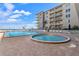 Resort-style pool and spa with ample lounge chairs at 4155 S Atlantic Ave # 210, New Smyrna Beach, FL 32169