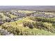Aerial view of golf course and surrounding neighborhood at 422 Troon Cir, Davenport, FL 33897