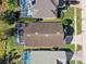 Aerial view of a house with a pool and surrounding neighborhood at 422 Troon Cir, Davenport, FL 33897