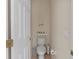 Small bathroom with toilet and shelf at 422 Troon Cir, Davenport, FL 33897