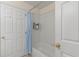 Bathroom with a shower/tub combo and light blue shower curtain at 422 Troon Cir, Davenport, FL 33897