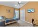Small bedroom with a twin bed and window at 422 Troon Cir, Davenport, FL 33897