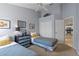 Twin bedroom with two beds and kitchen view at 422 Troon Cir, Davenport, FL 33897