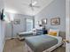 Twin bedroom with two beds and a ceiling fan at 422 Troon Cir, Davenport, FL 33897
