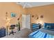 Bright bedroom with a desk, dresser, and a bed at 422 Troon Cir, Davenport, FL 33897