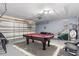 Garage with a pool table and basketball hoop at 422 Troon Cir, Davenport, FL 33897