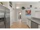 Modern kitchen with stainless steel appliances and granite countertops at 422 Troon Cir, Davenport, FL 33897