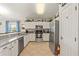 Kitchen with stainless steel appliances and granite countertops at 422 Troon Cir, Davenport, FL 33897