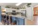 Kitchen with granite countertops, stainless steel appliances, and a breakfast bar at 422 Troon Cir, Davenport, FL 33897