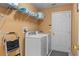 Laundry room with washer, dryer, and shelving at 422 Troon Cir, Davenport, FL 33897