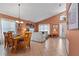 Open concept living and dining area with tile flooring, and neutral color palette at 422 Troon Cir, Davenport, FL 33897