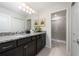 Bathroom with granite countertop, dark brown vanity, and shower at 4322 Lana Ave, Davenport, FL 33897