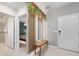 Bright and airy entryway with a bench, mirror, and view of the bedroom at 4322 Lana Ave, Davenport, FL 33897