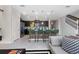 Modern kitchen with green barstools and a view of the living room at 4322 Lana Ave, Davenport, FL 33897