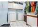 Laundry room with washer, dryer, and ample cabinet storage at 6316 Autumn Chase Ln, Orlando, FL 32818